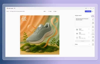 A close-up of a grey shoe with white soles placed next to green plants.