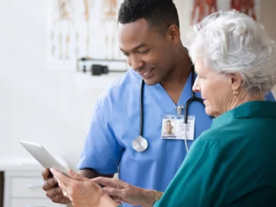 Two people looking at the screen