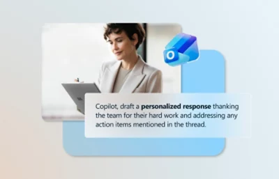 A woman holding a laptop with visible text on the screen.