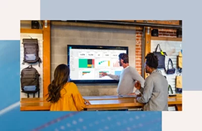 A group of people looking at a computer screen.
