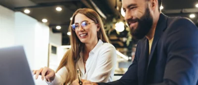 A man and women working on laptop