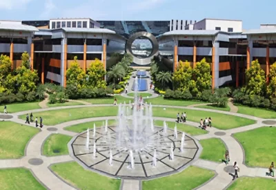 A green ground having a water fountain and office area