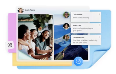 Un grupo de personas sonriendo y mirando un teléfono.