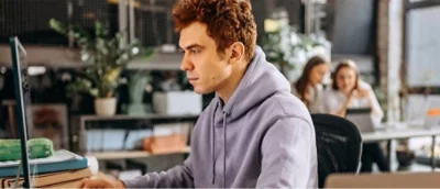 A person in a grey hoodie