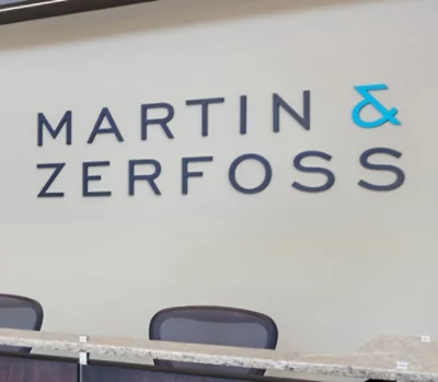 Office reception area with "Martin & Zerfoss" in bold letters on a light wall.