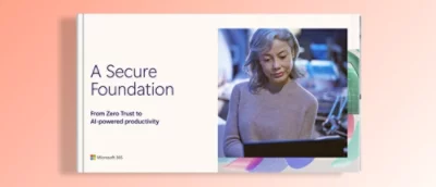 A woman looking at a white book with blue text titled A Secure Foundation: From Zero Trust to AI-powered productivity.