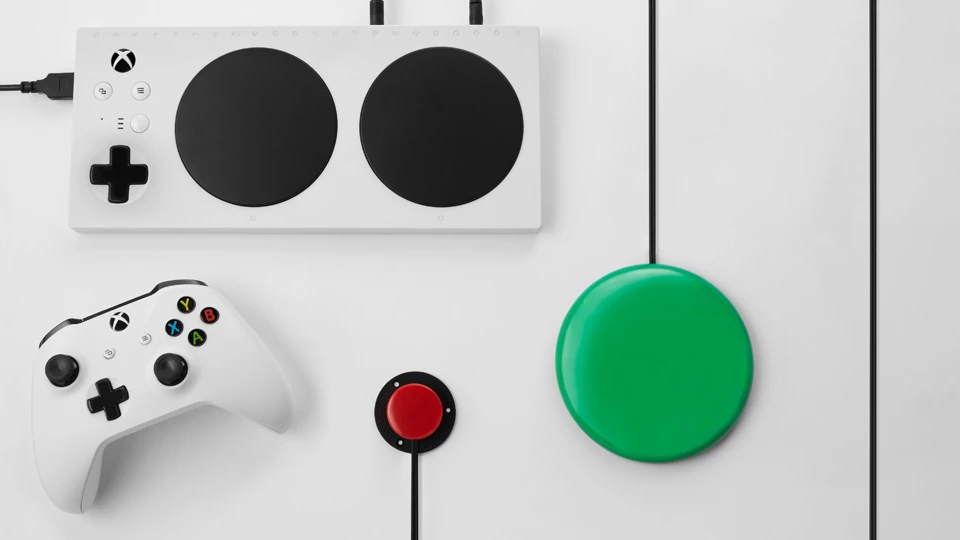 Xbox Adaptive Controller with external button, switch, and Xbox Wireless Controller.