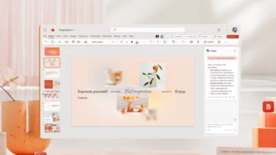 Eine PowerPoint-Präsentation, die auf einem Computerbildschirm angezeigt wird; zu sehen sind auch eine Unterhaltung und ein Benachrichtigungssymbol.