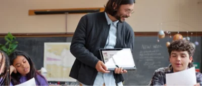 A person holding a computer