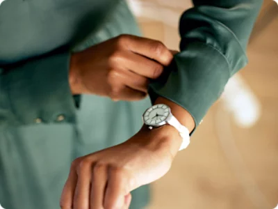 A close-up of a woman wearing a watch.