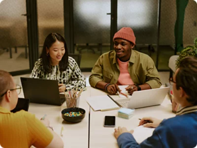 A group of people sitting around a table.